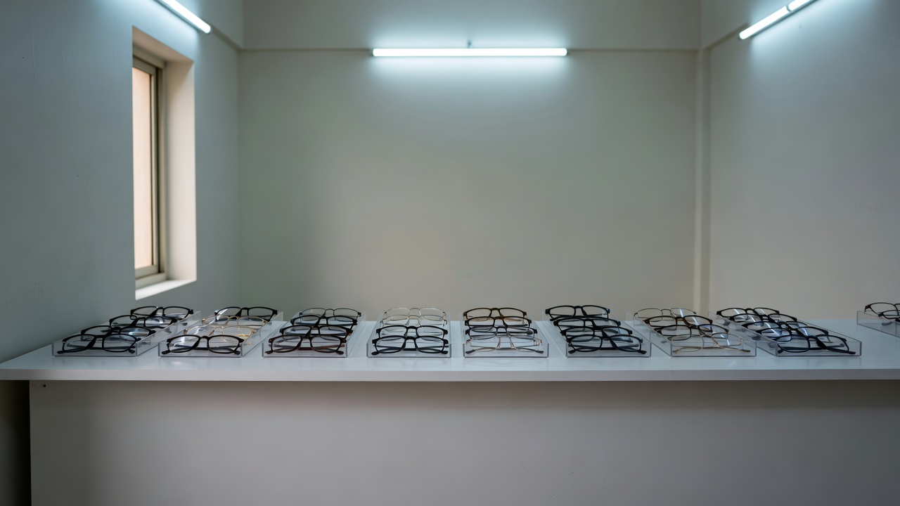 Spectacle display trays on a clean counter under soft light